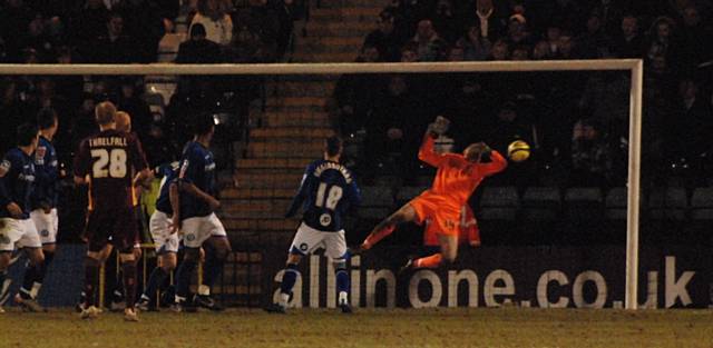 Robbie Threlfall's free kick hits the back of the Rochdale net.