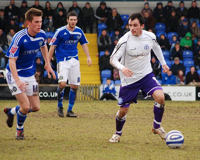 Chris Dagnall drives Dale forward.