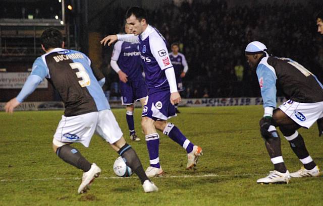 Dagnall looks for space in the Bury box.