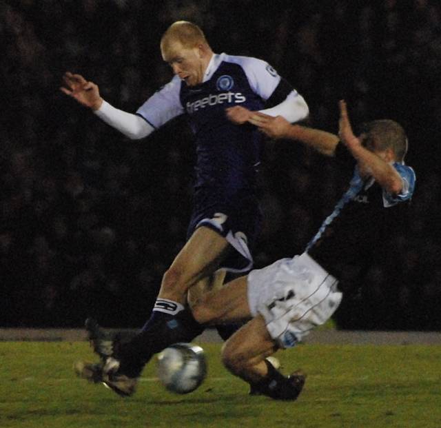 Stephen Dawson flies into a tackle on Jason Kennedy.