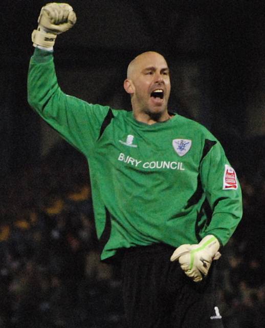 Brown celebrates Bury's goal in front of the Rochdale fans.