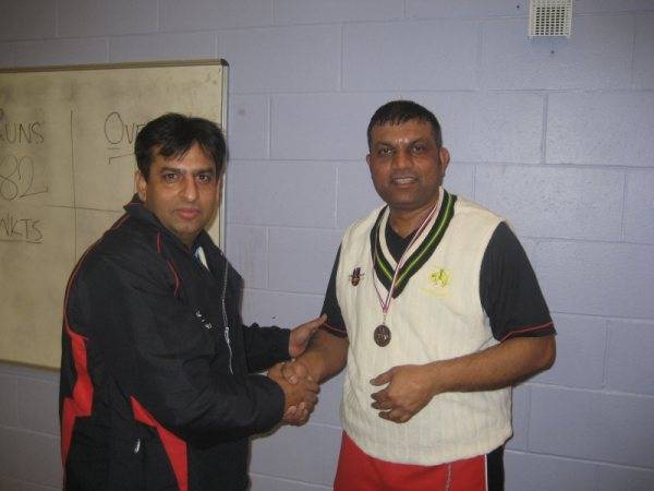 Iqbal of RYCC receiving man of the match award from M Siddique (one of the organisers of RPCL)