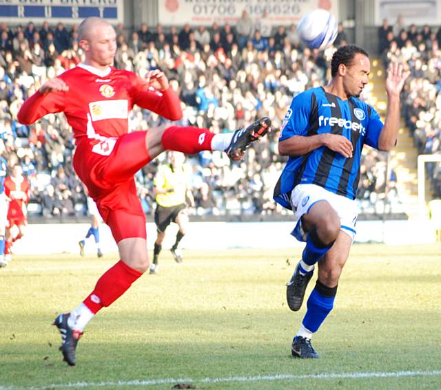 O'Grady puts pressure on a Crewe clearance.