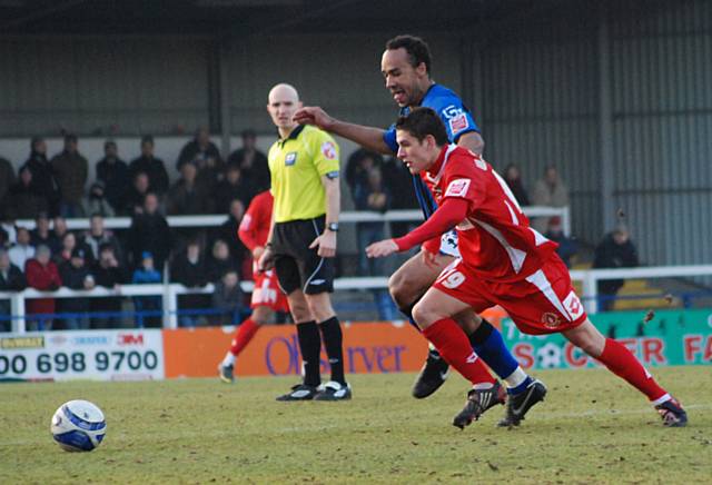 O'Grady and Westwood battle for possession.