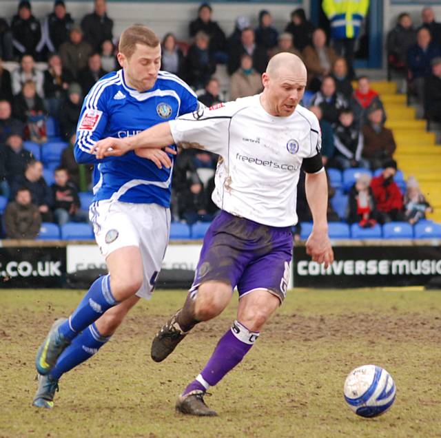 Jones looks to get clear from Sean Hessey.