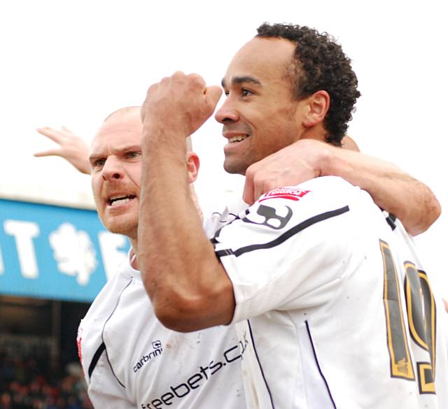 O'Grady and Jones celebrate the winning goal.