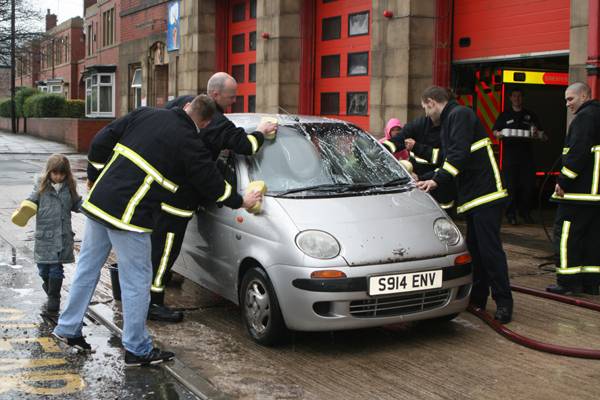 Firefighters put a shine back onto cars