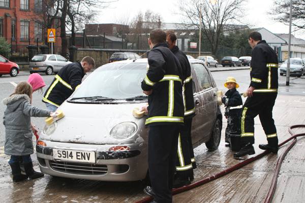 Firefighters put a shine back onto cars