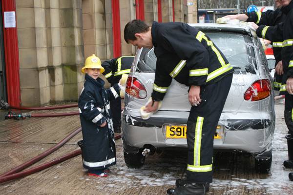 Firefighters put a shine back onto cars