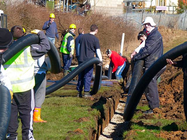 Thornham Cricket Club members working on the new drainage system