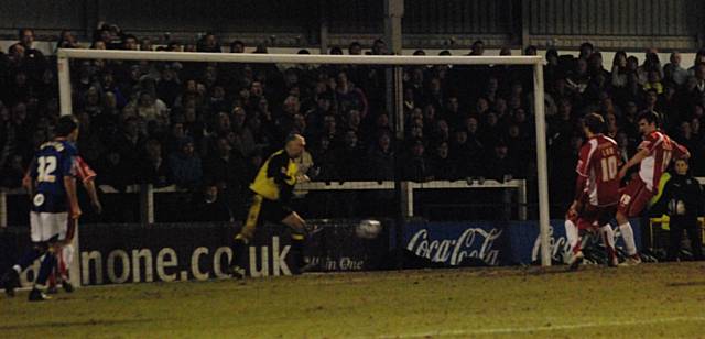 Gunning smashes the ball across his own goal before it hits Green and finds the net.