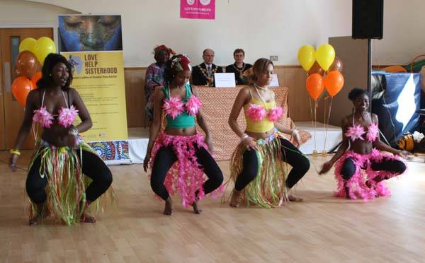 Traditional African dancers entertain the Mayor and Mayoress and the community who gathered to watch