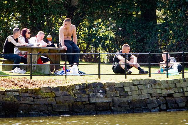 Young people relaxing in Springfield Park