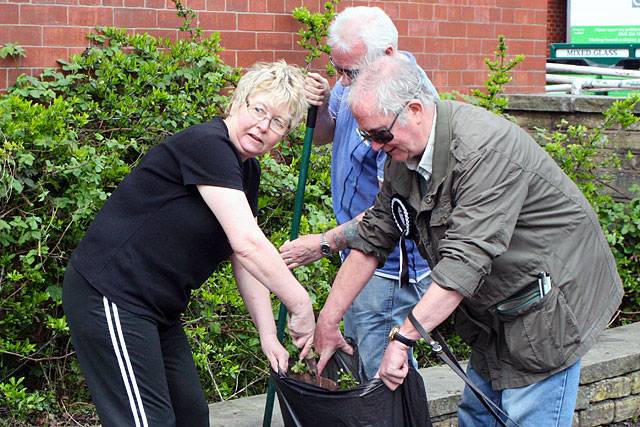 Sylvia and Rod Barry tidying up around Castleton Community Centre with the help of Frank Salt, who is standing as an independent in the local election