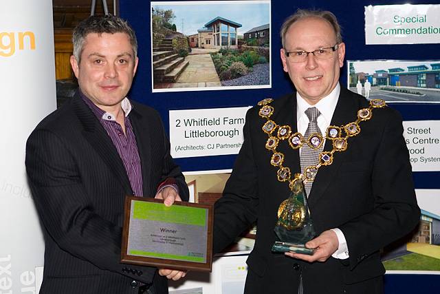 Paul Clark of C J Partnership collects the Rochdale Borough Design Award from Mayor Keith Swift