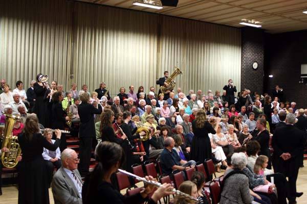 Wartburg Wind Band play in the audience at the Heywood Civic Centre