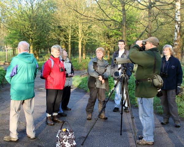 Bird watchers surround Jim Taylor to find out more about the birds at Hollingworth Lake