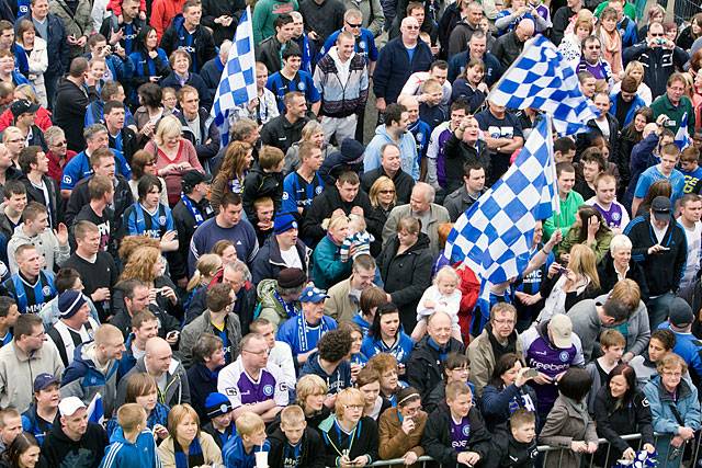 A crowd of thousands in the Town Centre to watch the Rochdale Football Club open top bus arrive at the Town Hall Civic Reception