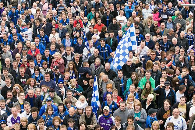 A crowd of thousands in the Town Centre to watch the Rochdale Football Club open top bus arrive at the Town Hall Civic Reception