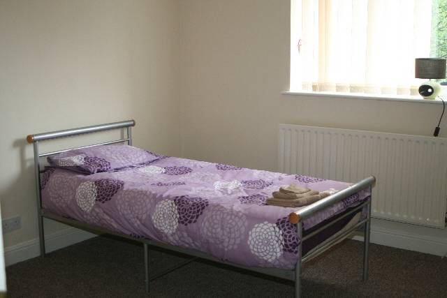 One of the eight bedrooms in Redwood House