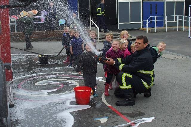 Fire-fighter Steve Webb with the youngsters