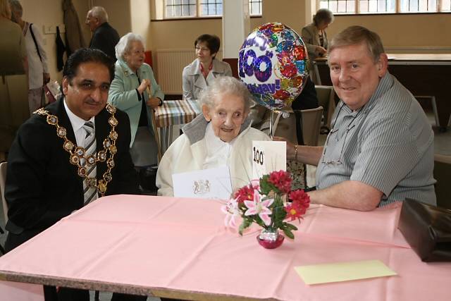 Millicent Stringer celebrating her 100th birthday with her son, Trevor and the Mayor of Rochdale, Councillor Zulfiqar Ali