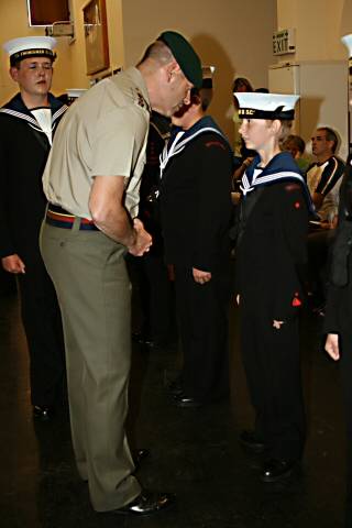 Lt. Col Davies speaking to a younger Rochdale Sea Cadet