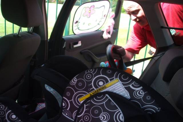 A car seat safety check taking place