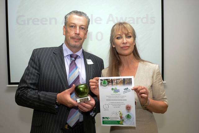 Centre Manager Lorenzo O’Reilly receiving his award from actress Carol Royle