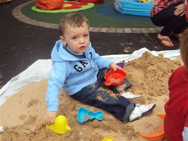 A child playing at the beach party