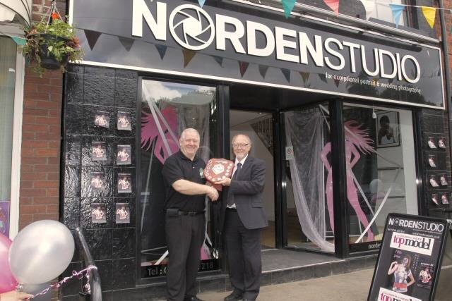 Jim Dobbin presenting the award to Graham Sivills in front of the studio 