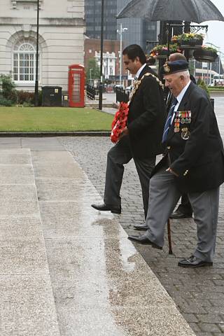 The Mayor of Rochdale, Councillor Zulfiqar Ali and D-Day veteran Cyril Watts make their way to the cenotaph