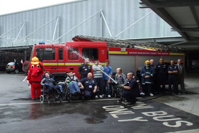 The fire-fighters with Redwood Special School Sixth Form students