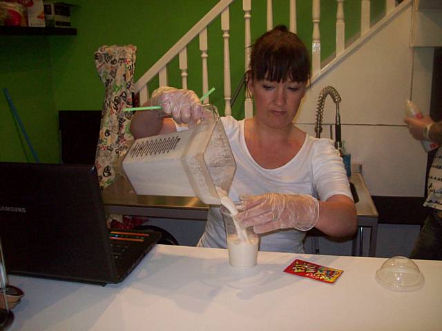 Shop owner, Michaela Fernandez, making a milkshake at the new shop in The Walk