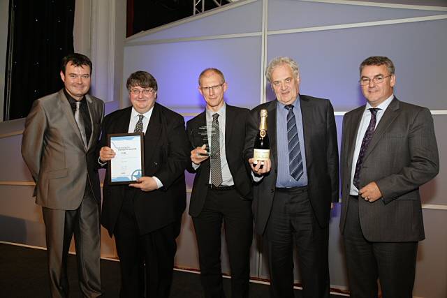 Grant Stott; Councillor Keith Whitmore, GMITA Vice Chairman; David Leather, GMPTE Chief Executive; Councillor Ian Macdonald, GMITA Chairman, and Peter Yendall, Head of Government Services, AECOM, who presented the award