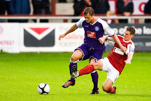 Fleetwood Town v Rochdale - Scott Wiseman rides a tackle