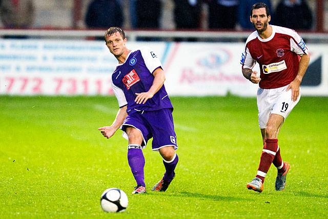 Fleetwood Town v Rochdale - Scott Wiseman plays a slide rule pass with Fleetwood's Gareth Seddon an onlooker