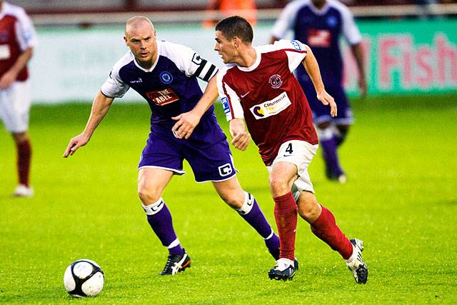 Fleetwood Town v Rochdale - Gary Jones chases Fleetwood's Anthony Barry