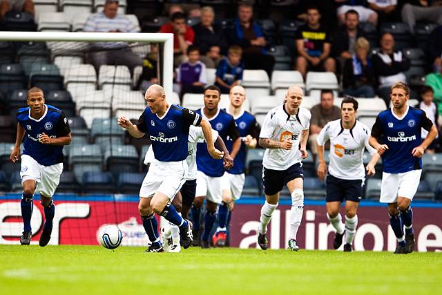 Gary Jones pursued by players from both sides