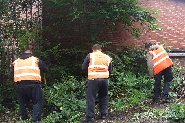 Offenders clean-up Spodden Street as part of their Community Payback punishment