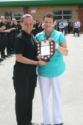 Karen Harris receiving her award from Luke Jamieson’s mother, Rose. 
