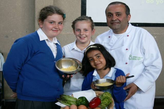 Aazam Ahmad with school pupils