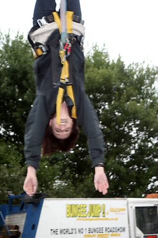 A woman mid bungee jump