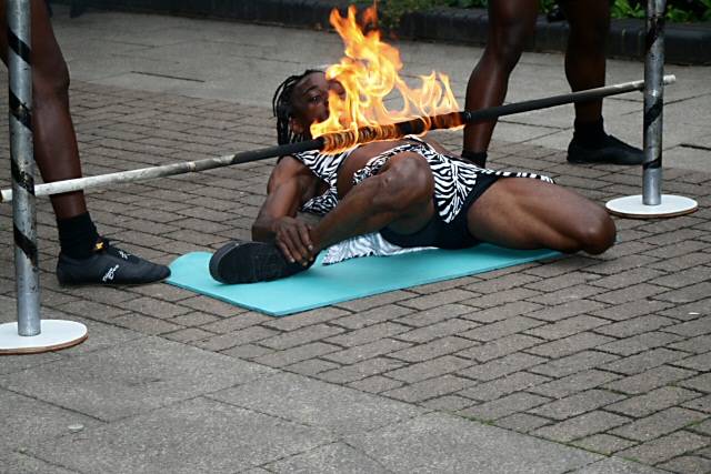 Black Eagle acrobat member playing with fire