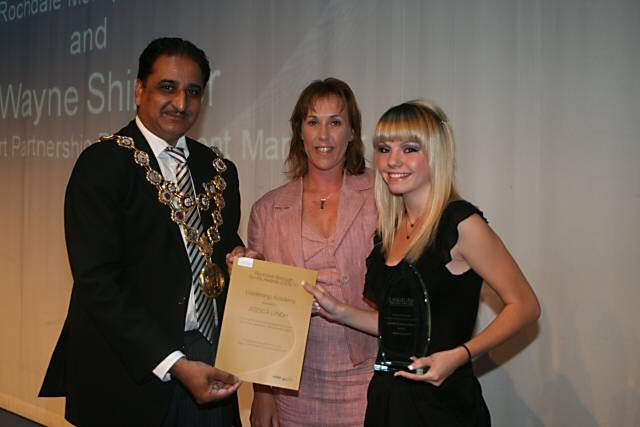 The Mayor of Rochdale, Councillor Zulfiqar Ali and School Sport Partnership Development Manager present Jessica Lynch the Leadership Academy Award