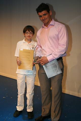 Under 12's Archery Champion William Taylor presents Dervish Dervish with the Coach of the Year Award