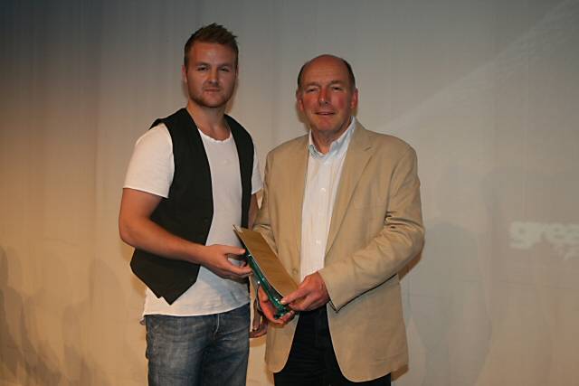 Great British Male Handball Captain Ciaran Williams presents the Sports Achiever of the Year award to Matthew Mee's dad Roger who collected the award on his sons behalf