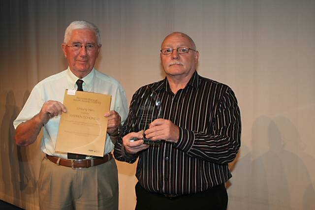 Chairman of the Link4Life Board Brian Ashworth presenting the Unsung Hero Award to Warren Schofield