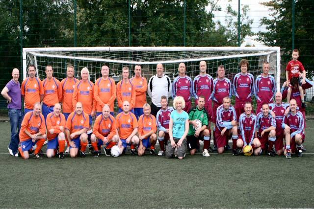 The players surround Clair Booth (centre) before kick off