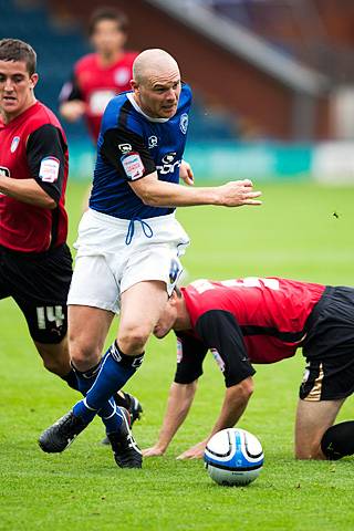 Rochdale 1 - 2 Colchester<br />Gary Jones rides the tackles